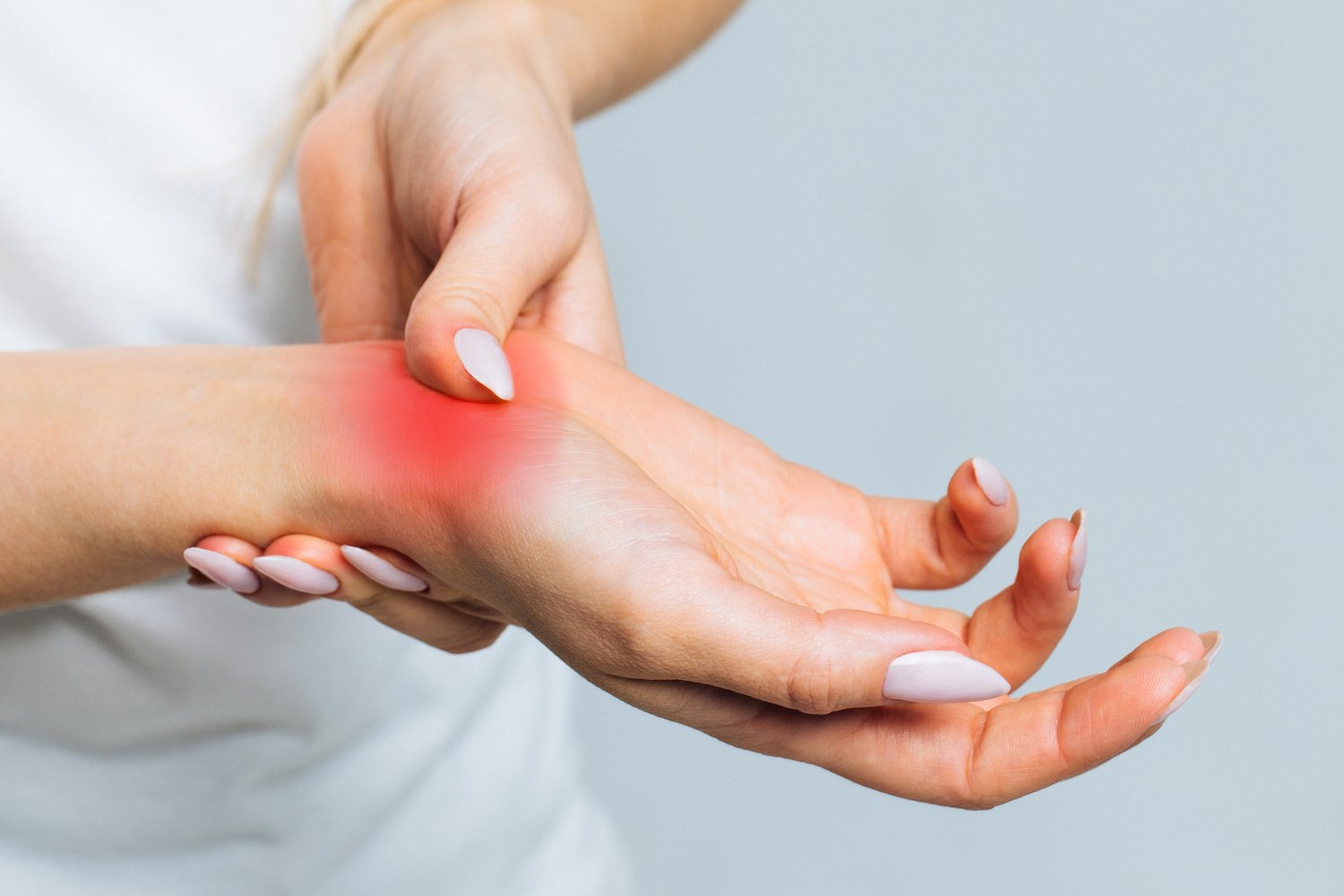 Young lady with wrist pain due to rheumatoid arthritis